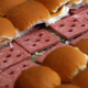 sliders being prepared on grill